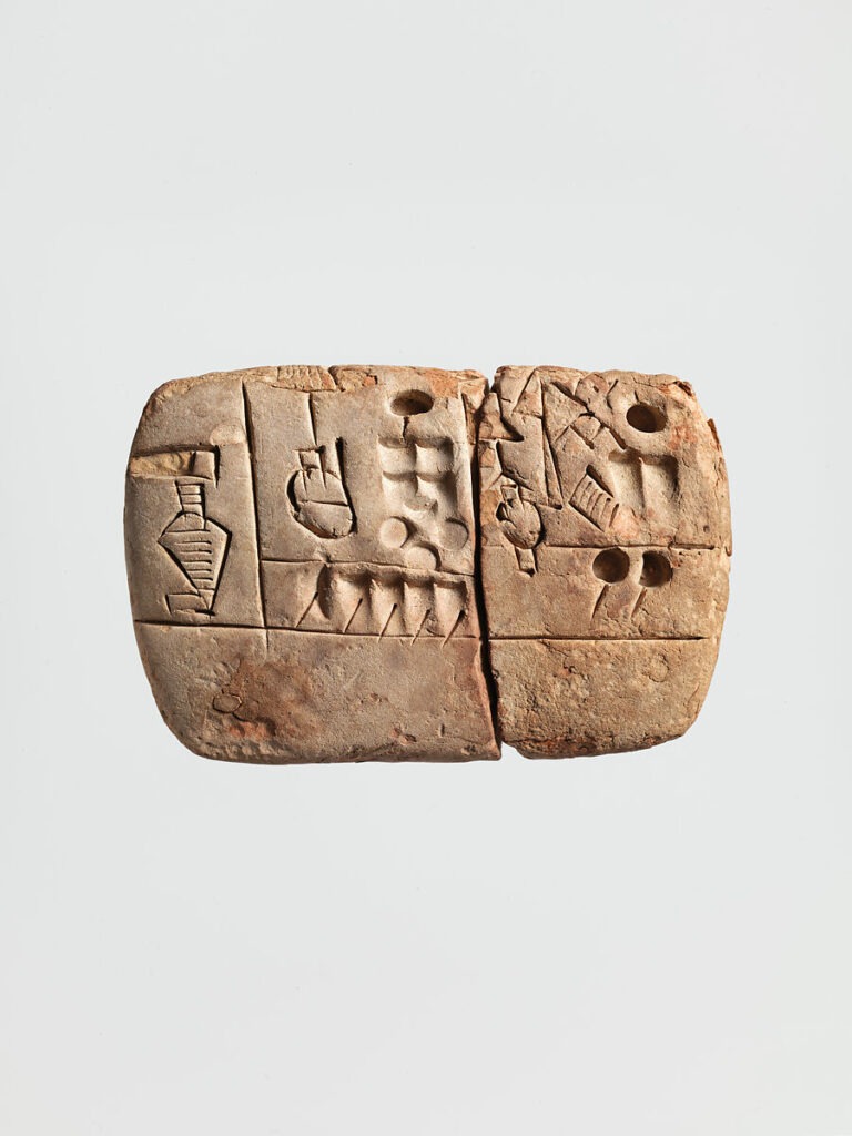 Close view of a clay tablet with cuneiform wedges impressed in neat rows