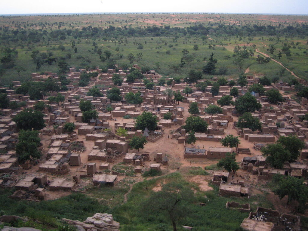 Dogon village of mud houses and granaries near the base of the Bandiagara escarpment