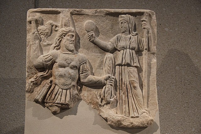Roman relief showing Jupiter and Juno enthroned, with symbols of state and law