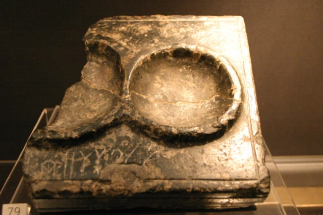 Stone libation table inscribed with Linear A.
