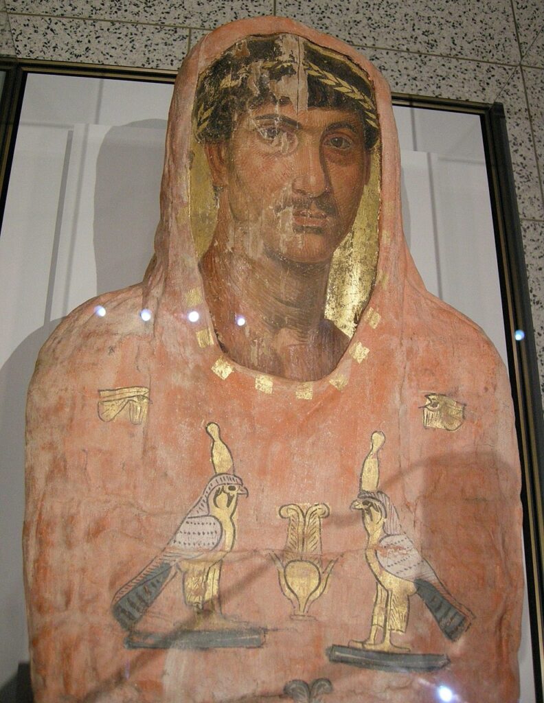 Mummy of Herakleides with the panel portrait still in place on the wrappings.