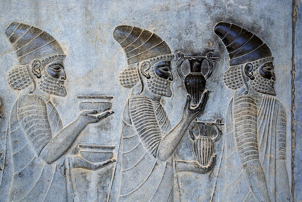 Persepolis terrace relief showing processional figures in calm profile.