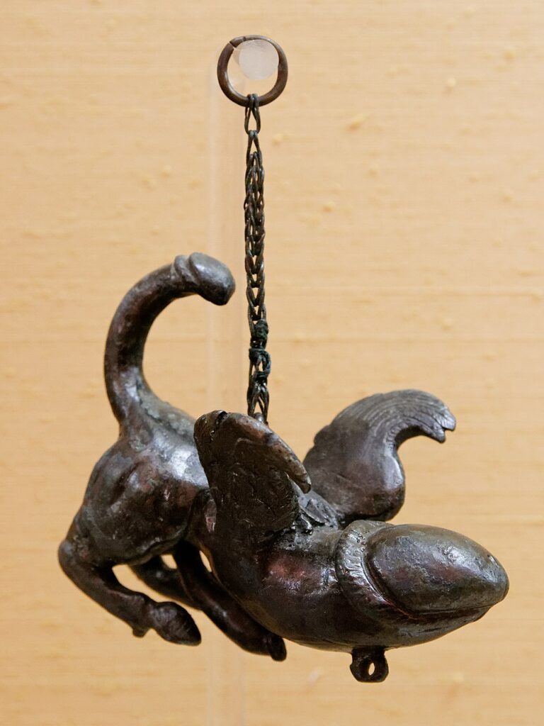Bronze tintinnabulum with phallic forms from Pompeii, displayed in the Naples Archaeological Museum.